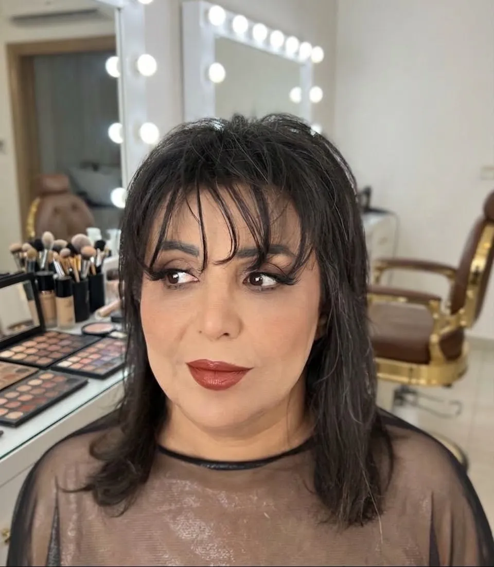 Classic event look with defined brows and a deep red lip