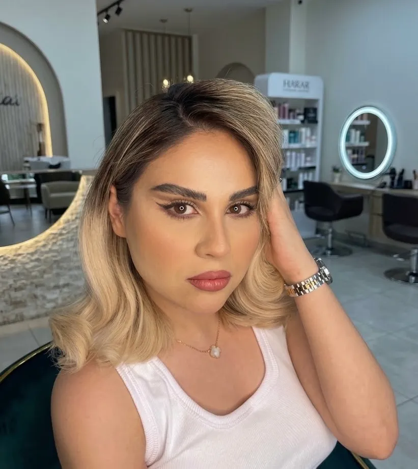 Polished natural look with a soft wing, defined brows and a warm rose lip on blonde waves